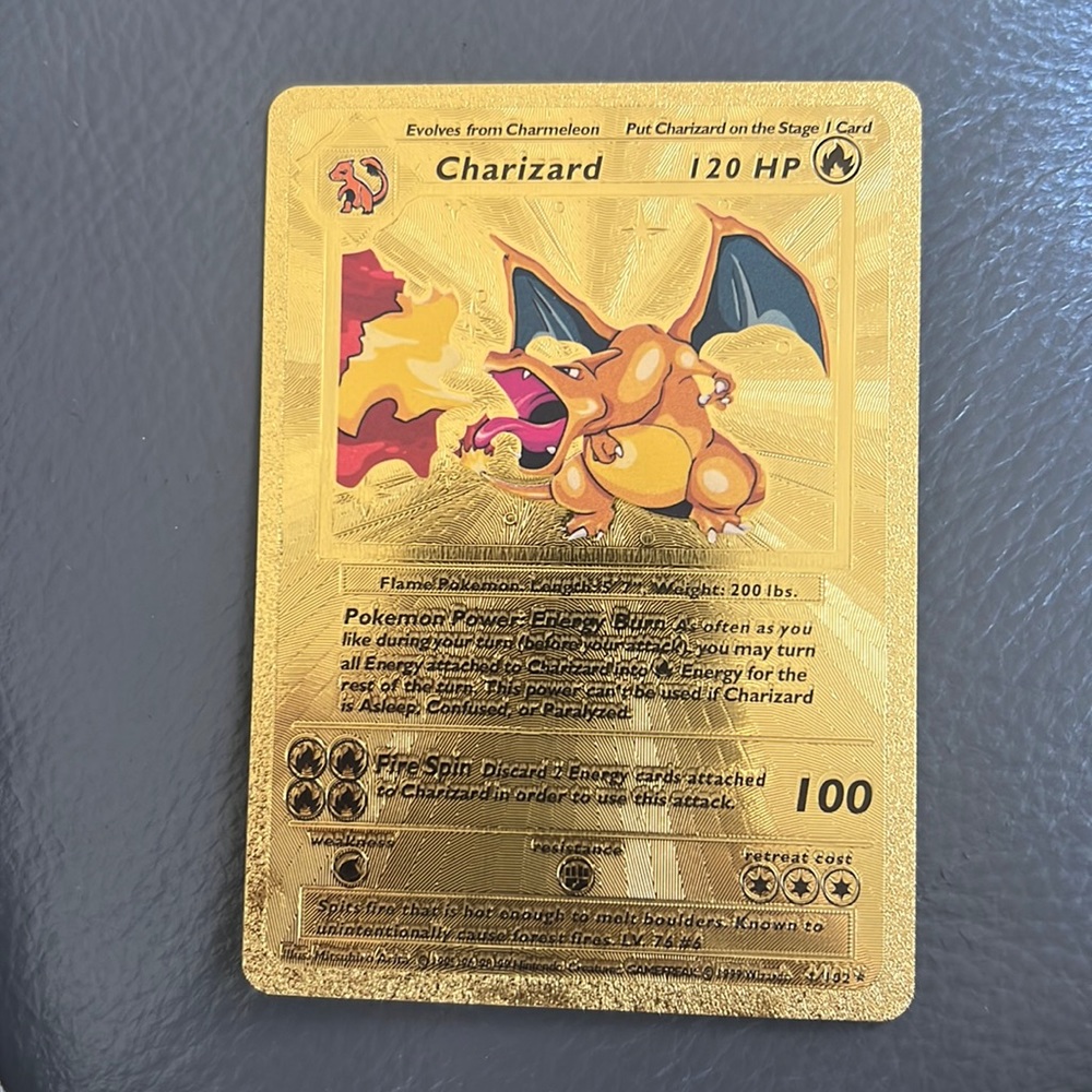 Selling my gold foil charizard card first edition in excellent condition